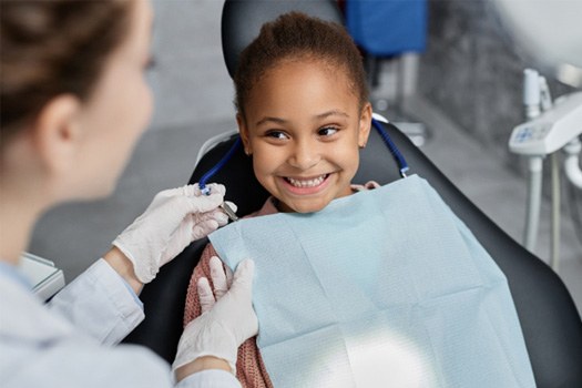 Child smiling at the dentist