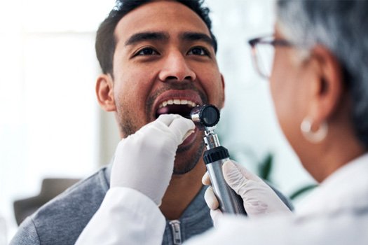 Man having his mouth checked